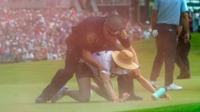Photo of Protesters storm the 18th green at Travelers Championship