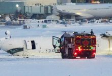 Photo of Passenger on flipped Delta jet in Toronto recalls being upside down, ‘hanging from our seatbelts’