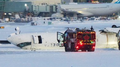 Photo of Passenger on flipped Delta jet in Toronto recalls being upside down, ‘hanging from our seatbelts’