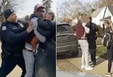 Photo of Video Shows Police Pinning Man Against SUV While He Holds Baby, Raising Concerns Over Child’s Safety and Sparking Public Outcry